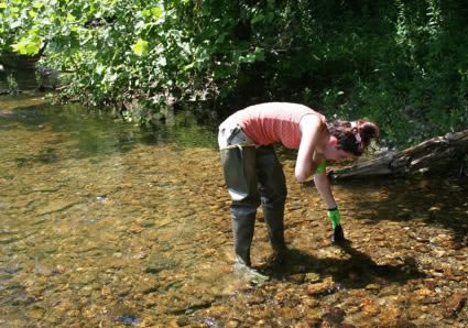 Emily Stulik '10 sampling water