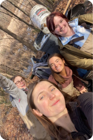 Students taking a selfie in the woods