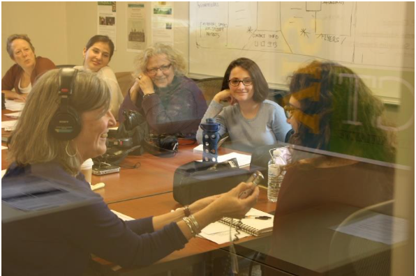 People recording oral histories in a conference room