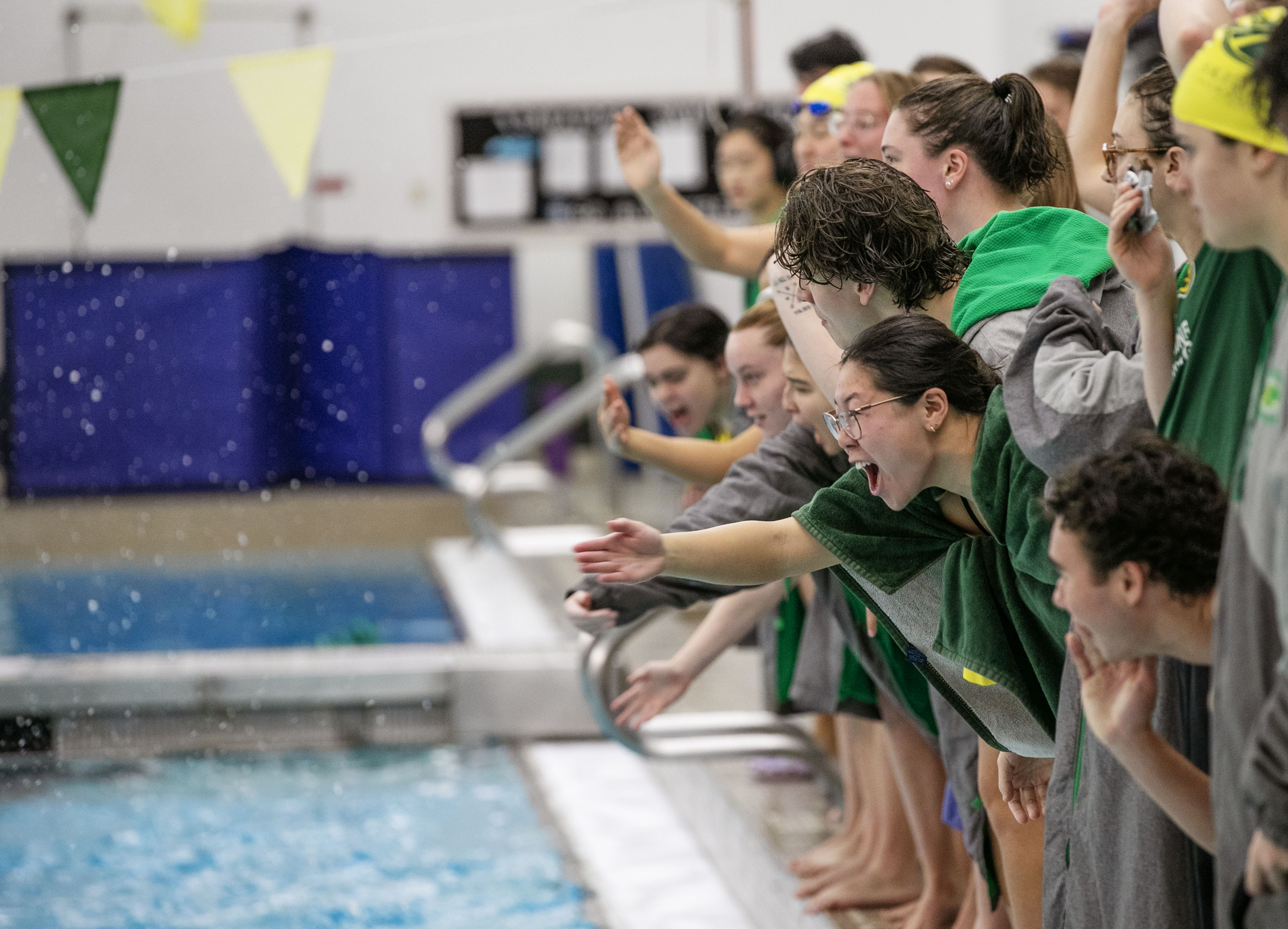 Members of the Skidmore College swimming and diving team cheer on teammates against SUNY Potsdam during Celebration Weekend Saturday, October 21, 2023. (Sarah Condon-Meyers / Skidmore College)