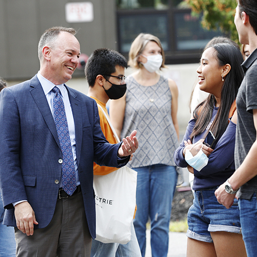 Skidmore President Marc C. Conner speaks with students