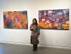 Natalie Accurso with her paintings