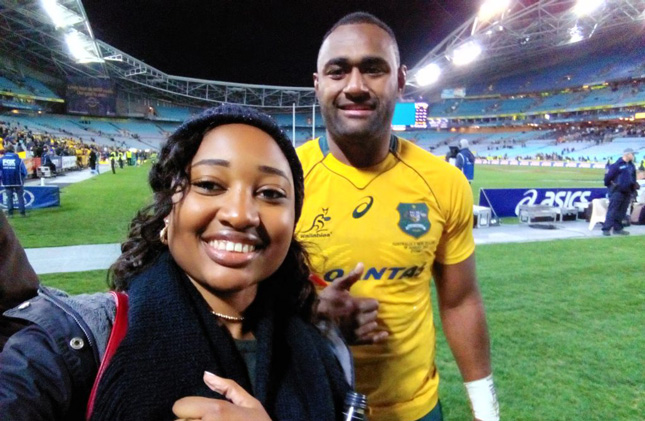 Student takes a selfie with an Australian football player
