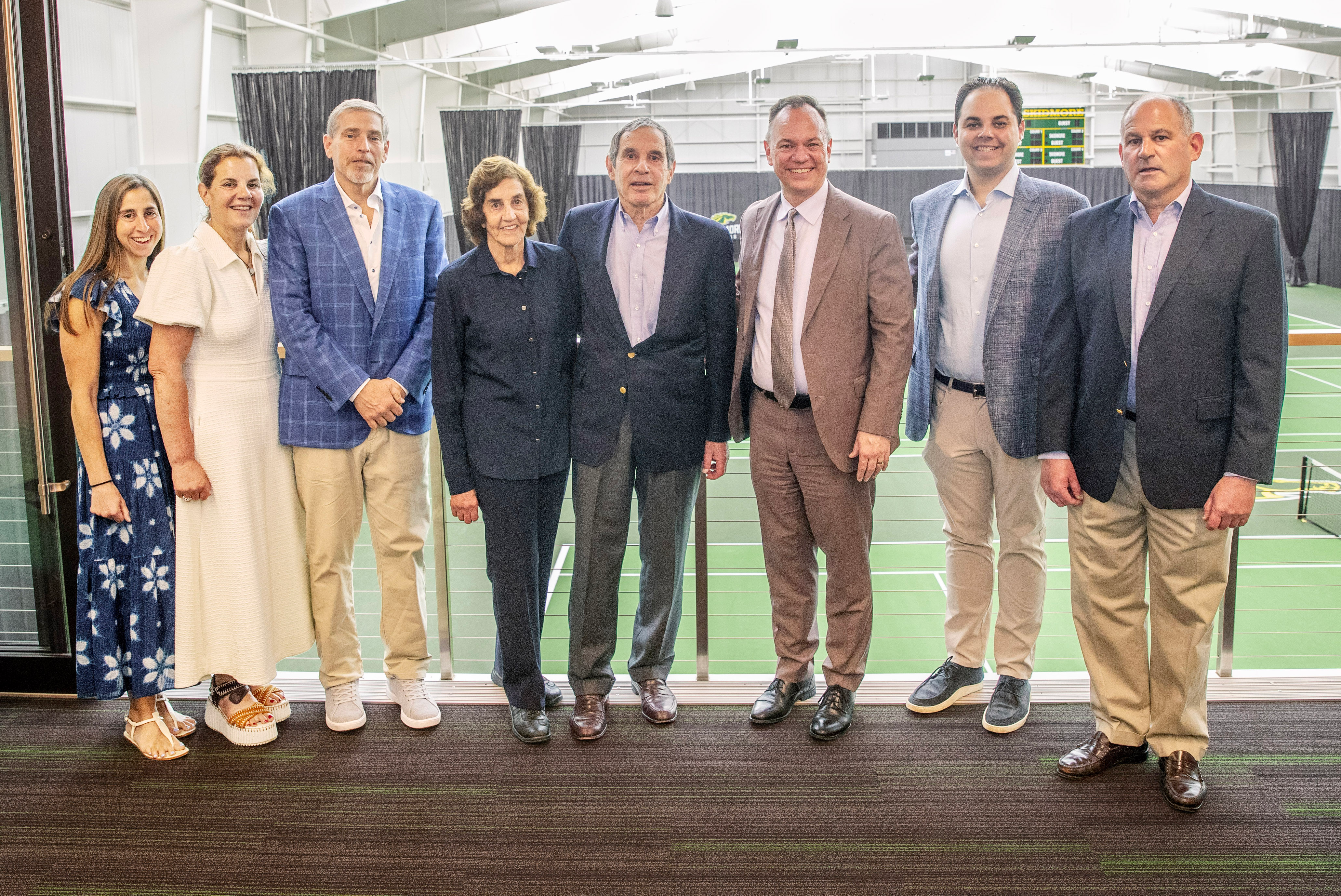 Lead donors gathered to celebrate the opening of the McCaffery-Wagman Tennis and Wellness Center, pictured here in front of the new indoor courts their generosity helped bring to life.