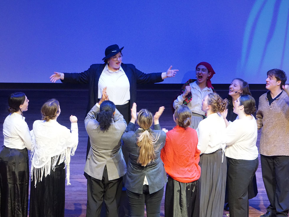 Group of actors on stage.