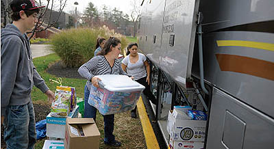 Students and staff join to donate and deliver supplies for Hurricane Sandy victims in New York City (photo by Charlie Samuels)