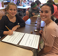 Fifth-grader Carly Fay works with Skidmore's Meghan Wojtkiewicz '16.
