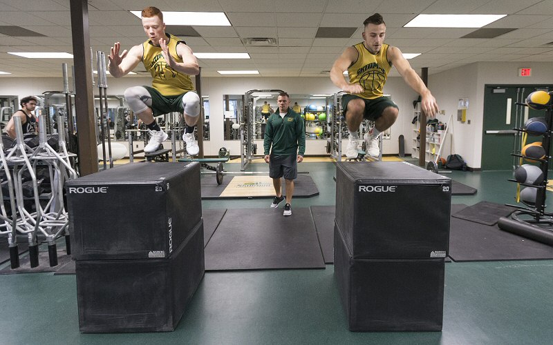 Sophomore Pat Gallagher '20 and Ed Rupkus '19 make prodigious leaps under the guidance of Matt Chatham, strength and conditioning coach for all T'bred teams.