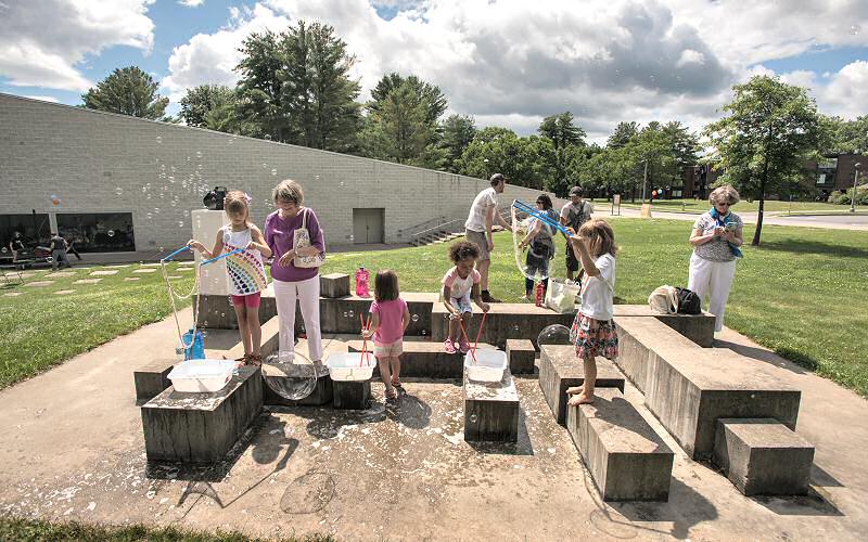 Suds and sunshine encourage young visitors to create ephemeral sculptures, iridescent mobiles and plenty of mess just outside the museum.