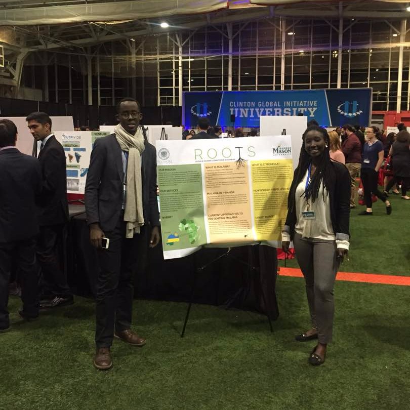 Muhire '18 with poster at CGI U