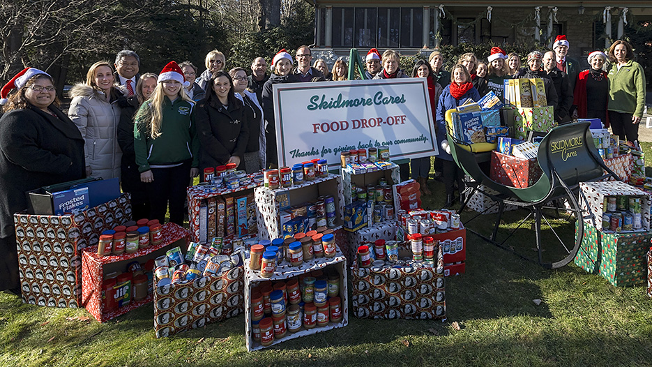 Participants in Skidmore Cares gather in front of Scribner House. 