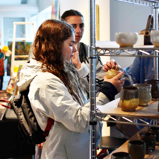 A+student+holds+handmade+pottery+at+the+Handmade+Pop-Up+store+on+April+27