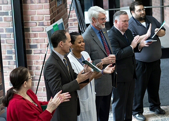 From left: Skidmore Trustees Susan Gottlieb Beckerman, Joshua Boyce and Diana Perry, President Glotzbach, Chairman of the Board of Trustees W. Scott McGraw and Associate Professor of Chemistry Kelly Sheppard applaud the beginning of CIS Phase 1 construction.