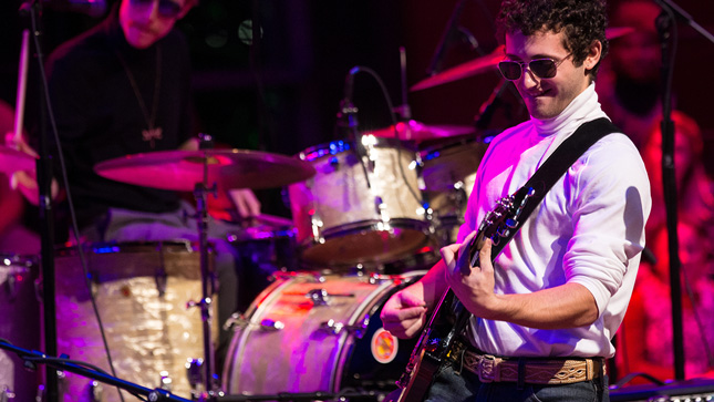 Skidmore students performing on stage for a Beatles tribute concert