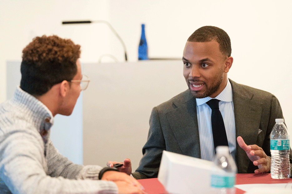 Zachary wood meets with a student.