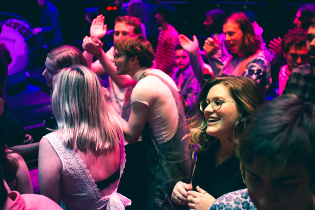 Student dancing on stage during Beatlemore Skidmania