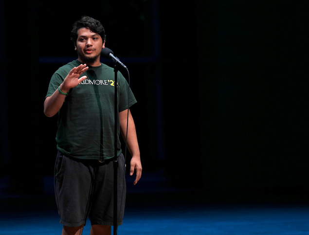 Male student on the stage at Skidmore College