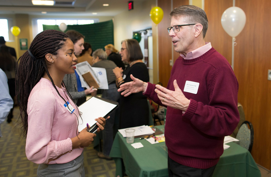 Skidmore college student speaks with a mentor at Career Jam