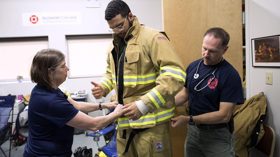 Professor Smith observes a firefighter during a recent research session at the First Responder lab.