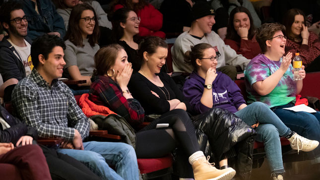 Skidmore College students watch a student comedy show