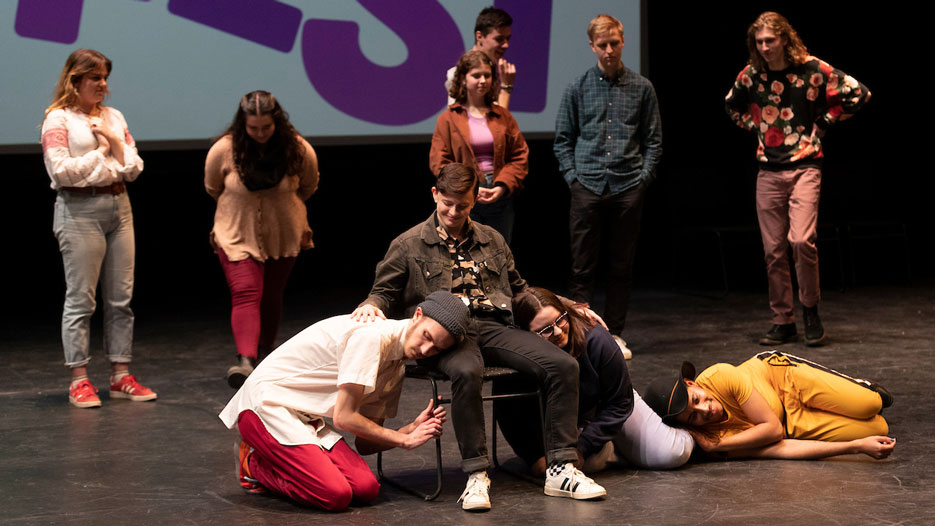 Skidmore College students perform improv on stage