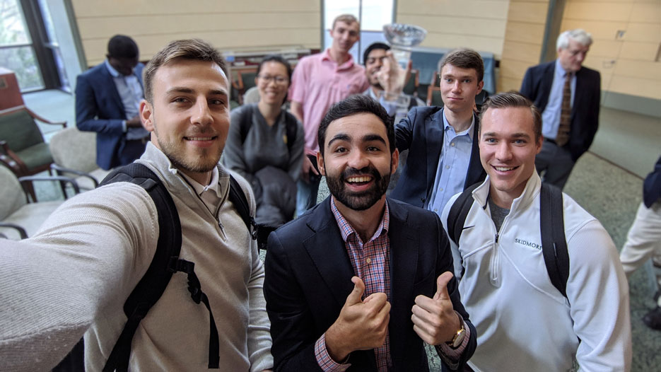 Investment Club members give thumbs up after getting Adirondack Cup trophy