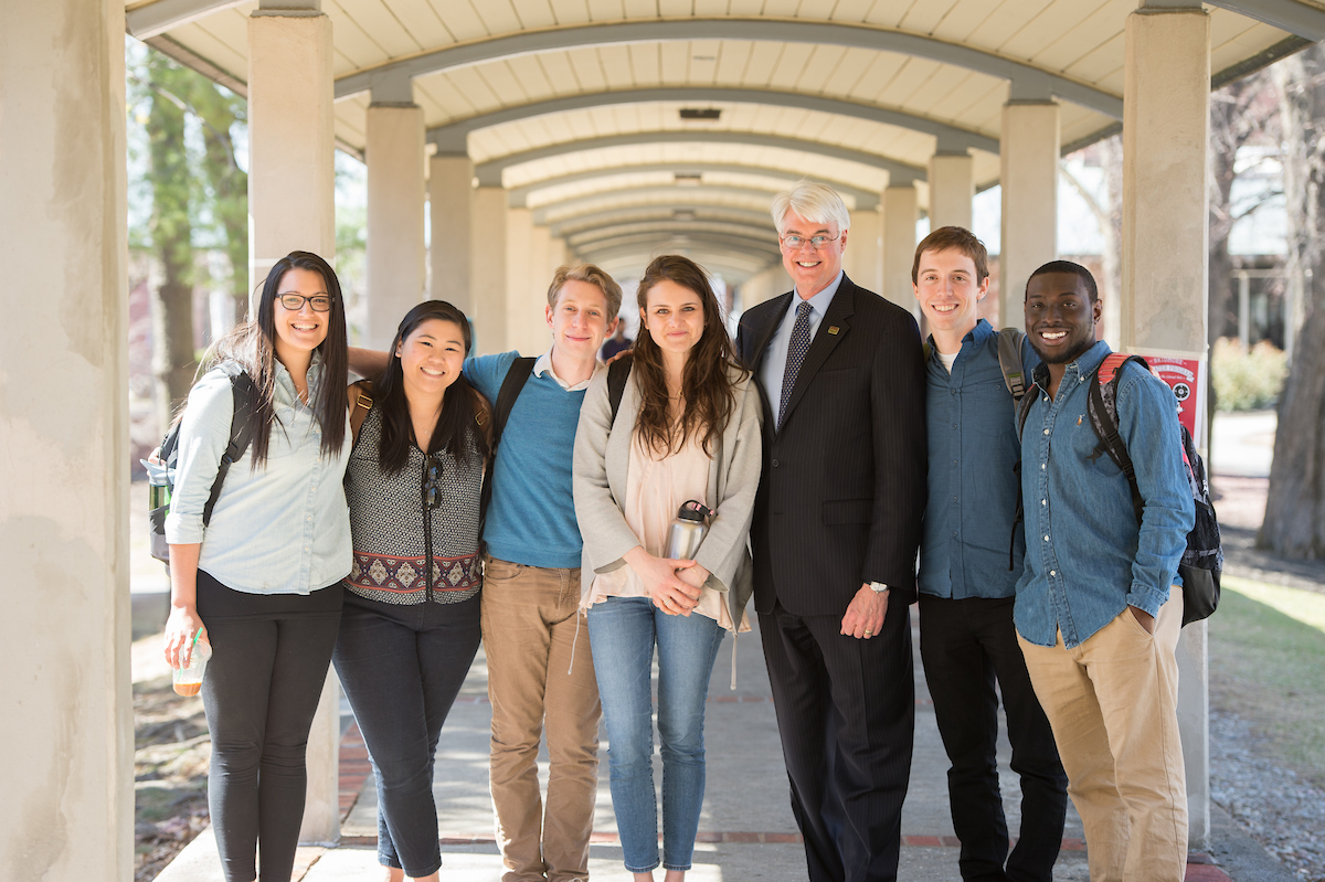 Phil Glotzbach interacts with students in the walkway near Case Center in 2015