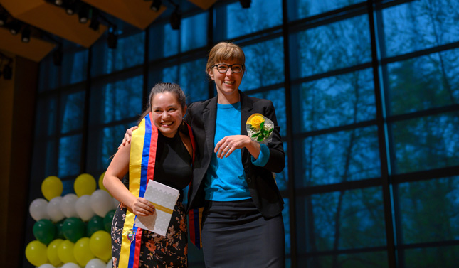 Cinthia Duran Larrea '19, and her mentor Katherine Paarlberg-kvam embrace during Skidmore's Stoles and Cords Recognition Ceremony at Zankel Music Center.