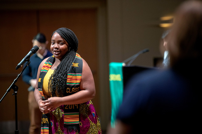 Etije Walker recognizes her mentor, Brenda Pashley during Skidmore's Stoles and Cords Recognition Ceremony at Zankel Music Center.