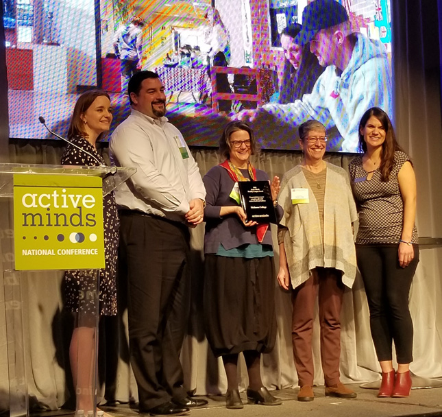 Skidmore College's Counseling Center and Health Services staff members accept the 2020 Active Minds Healthy Campus Award. 