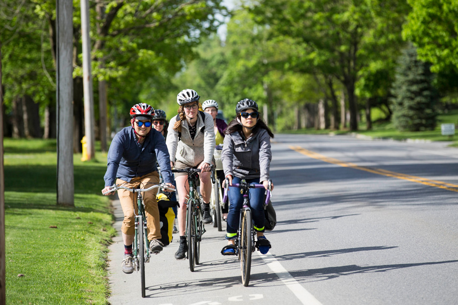Members of the Skidmore community bike to campus as part of National Bike to Work Day.