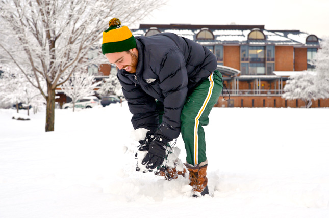 A student prepares to throw a snowball