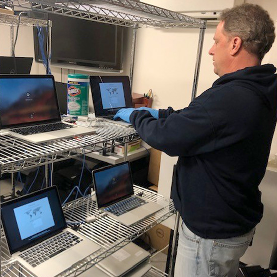 IT+prepares+laptops+for+working+remotely