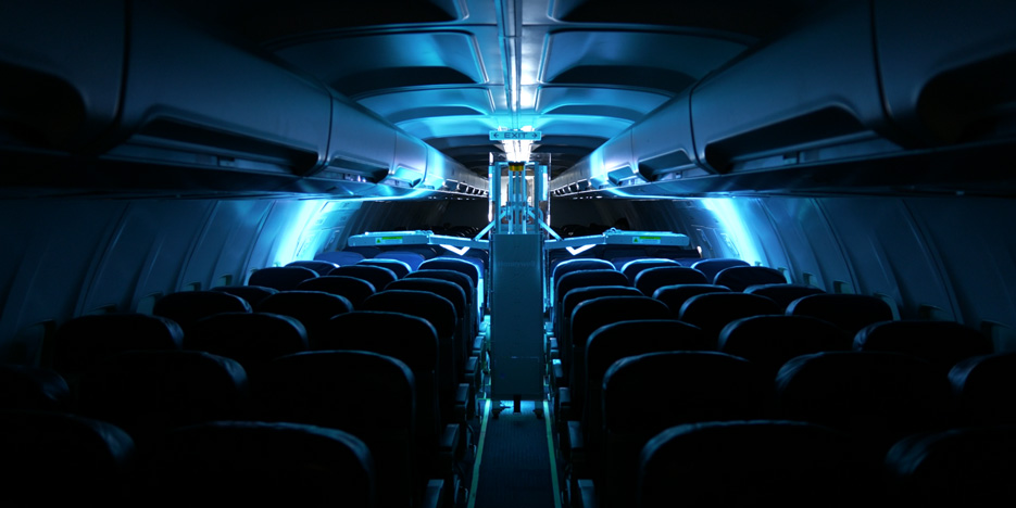 The Dimer GermFalcon disinfects the interior of an airplane with UVC light. 