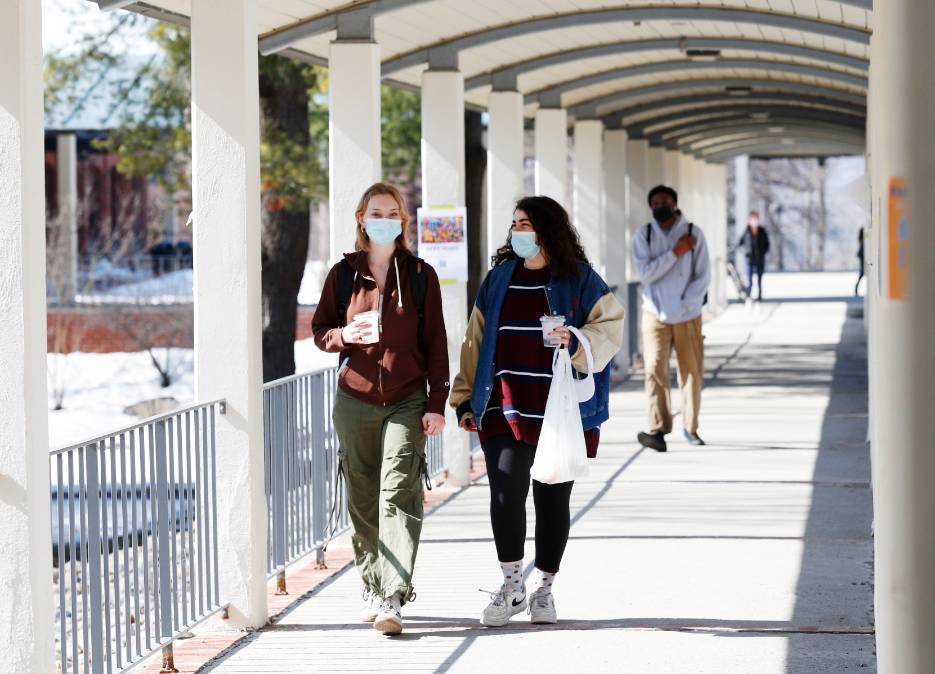 Allison Stern ’24 and Olivia Hahn '24 chat during a walk through central campus on a warm March day.  