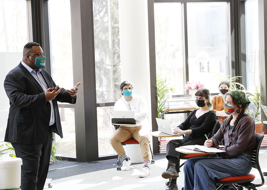 Emmanuel Balogun, assistant professor of political science, teaches his Comparative and International Politics course.  