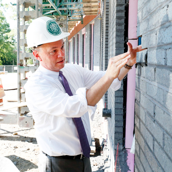 President+Marc+Conner+places+East+Wing+brick