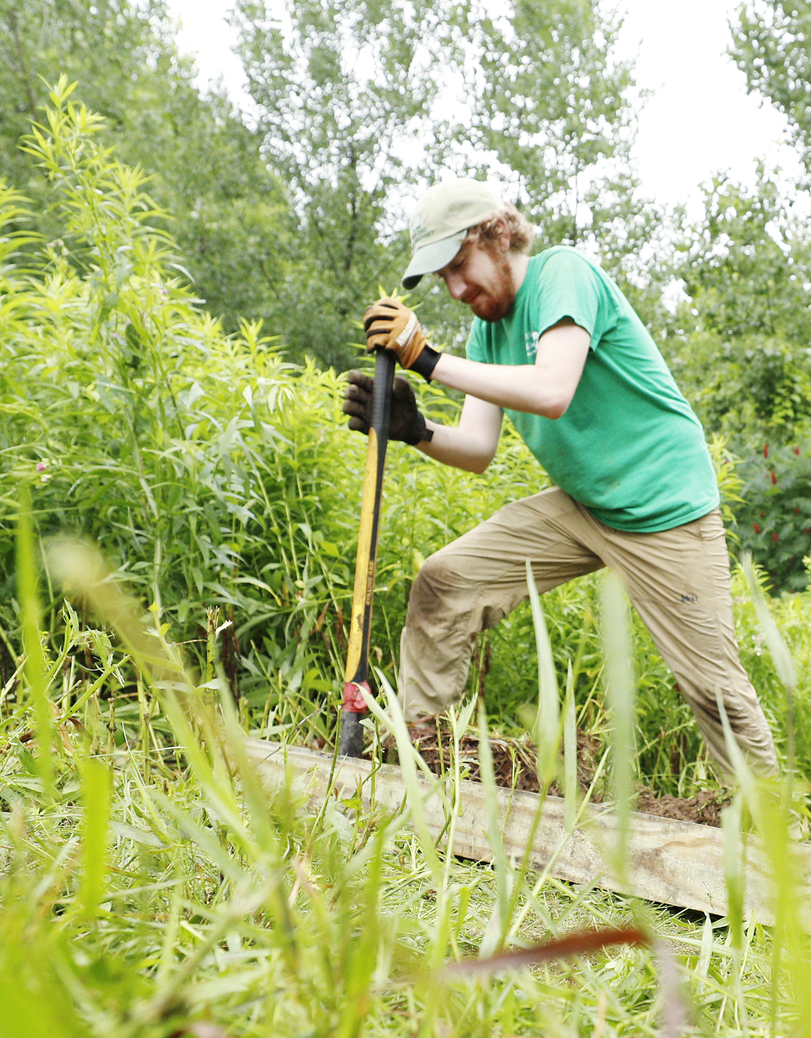 Jacob Adams ’21 spent his summer working as a North Woods steward, a student employee who helps to protect and raise awareness about the College’s 155 acres of protected woods. Here, he helps to build stairs leading to the woods.
