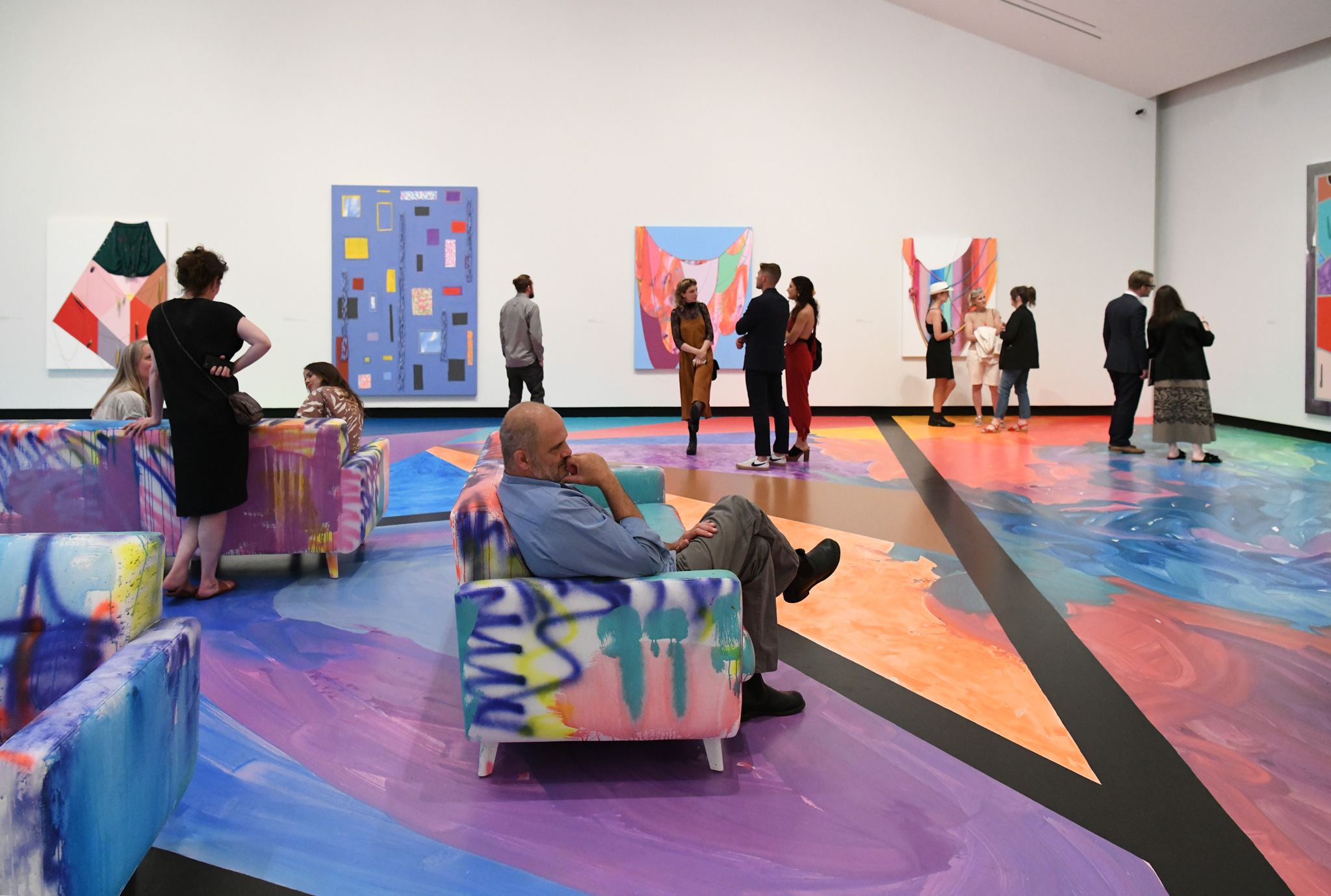 The Tang Teaching Museum and Art Gallery reopened to the public this summer. Here, visitors enjoy the exhibition “Opener 33: Sarah Cain — Enter the Center.” Photo by Cindy Schultz.