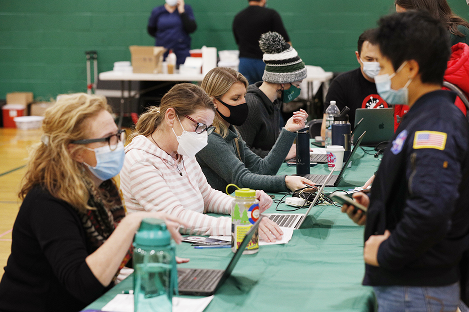 Volunteers register students at the clinic. 