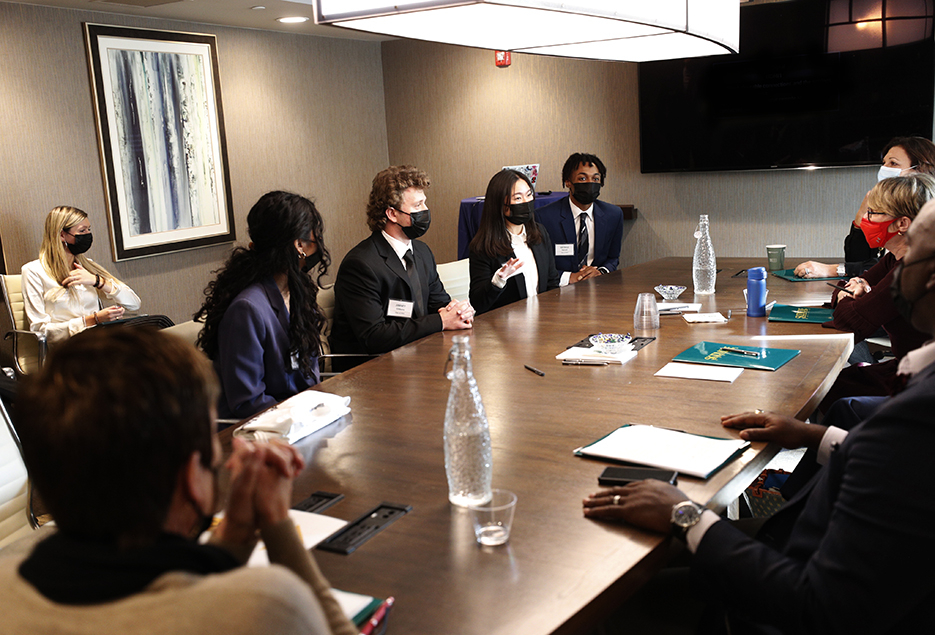 Students give their MB 107 executive presentations to a panelist of executives.