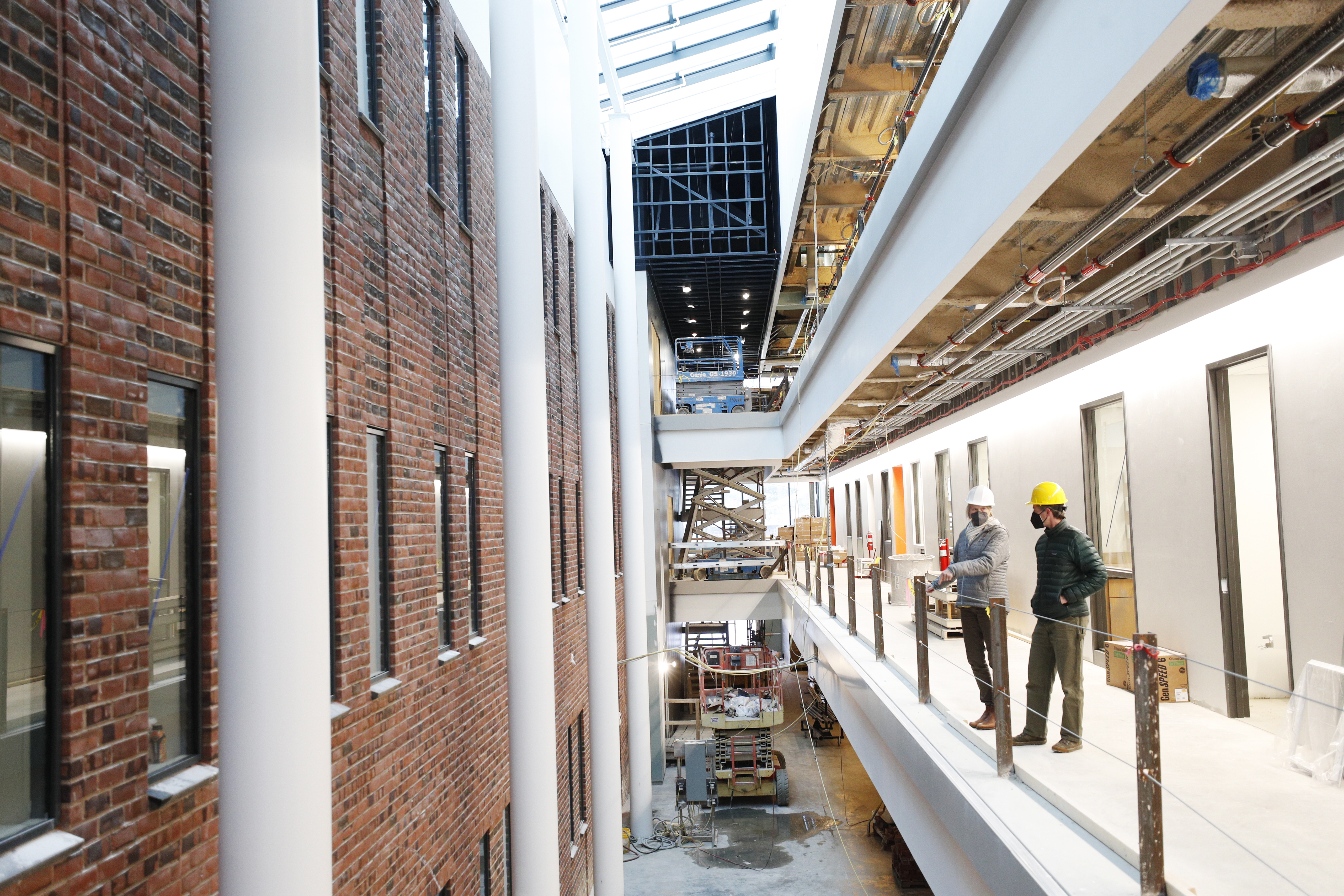 Associate Dean of the Faculty Pat Fehling and John Chaplin, senior director of principal gifts and presidential and trustee strategy, tour the North Wing of the Center for Integrated Science. 