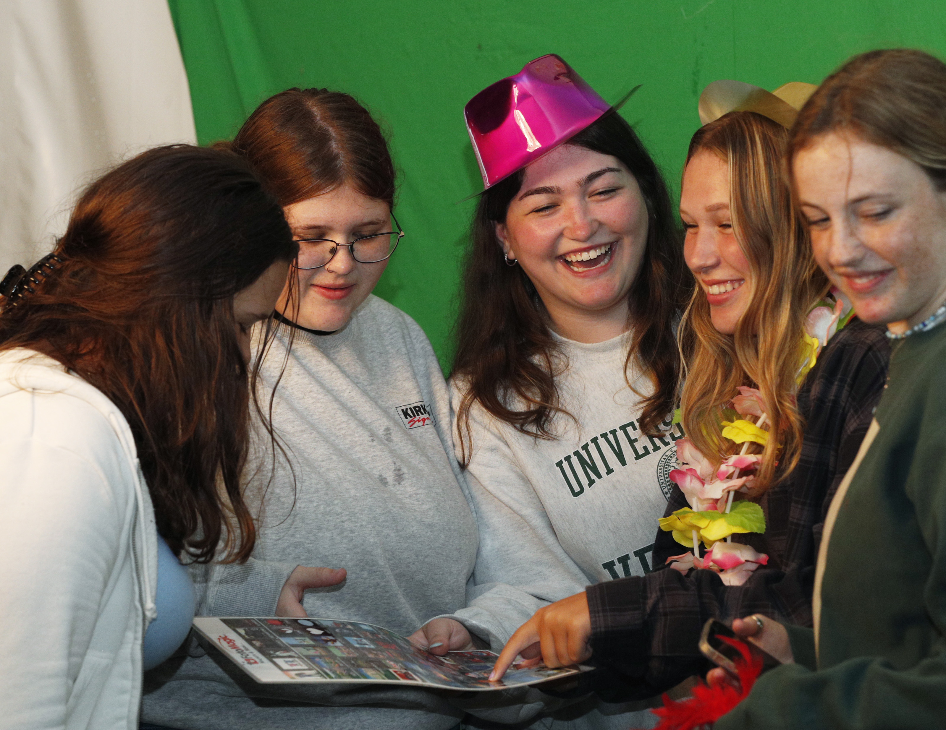 Skidmore students take photos in a photo booth during Founder's Day.