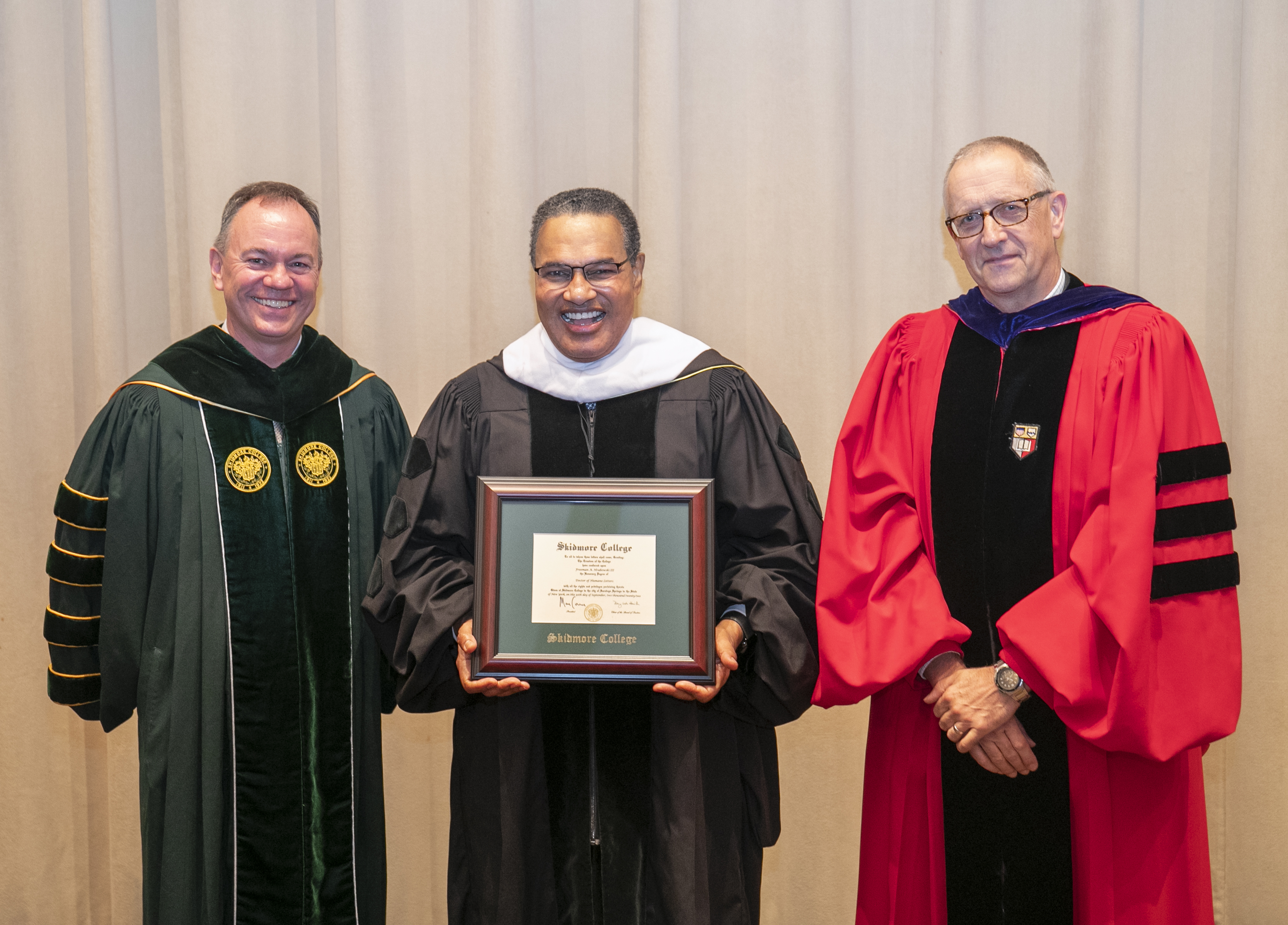 Freeman A. Hrabowski III, president emeritus of University of Maryland, Baltimore County, center, stands with Skidmore College President Marc C. Conner, left, and Dean of Faculty and Vice President for Academic Affairs Michael Orr after receiving an honorary degree from Skidmore. 