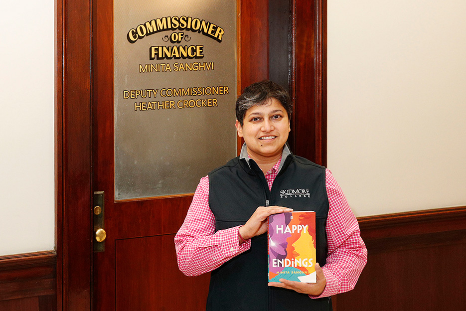 Associate Professor of Marketing Minita Sanghvi with her new novel outside her office in City Hall. 