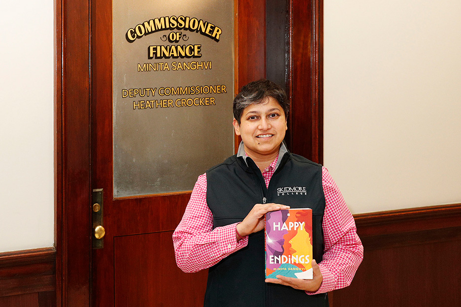 Associate Professor of Marketing Minita Sanghvi with her new novel outside her office in City Hall.