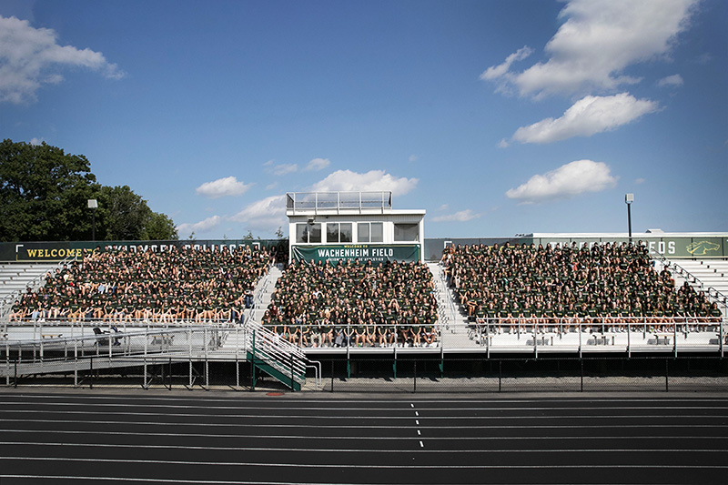 Skidmore's Class of 2027 sit in the bleachers. 