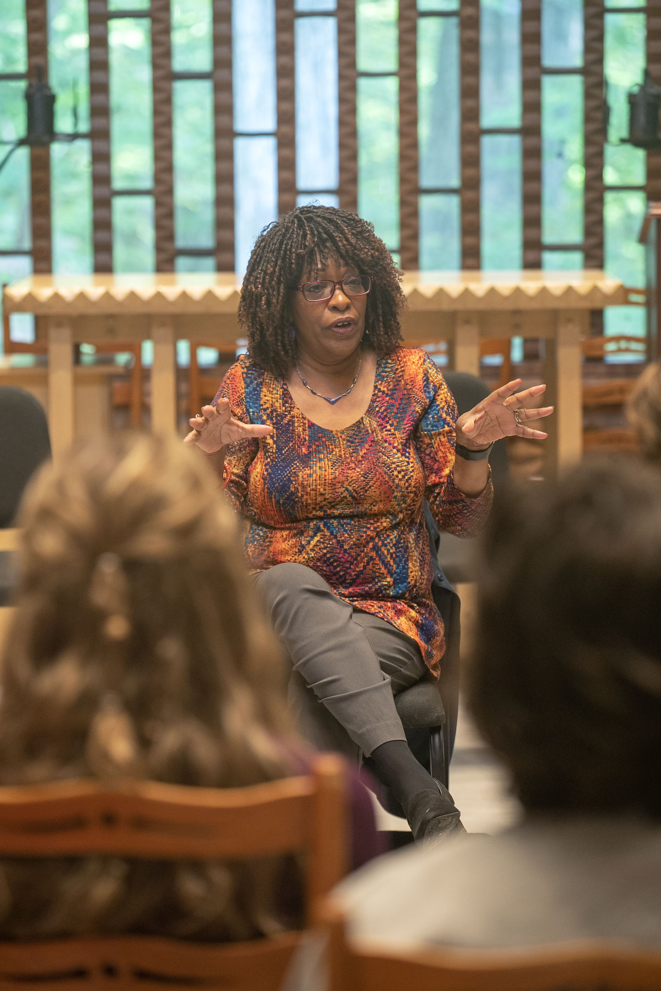 Rita Dove speaks in front of a room of enraptured audience members at the Wilson Chapel.