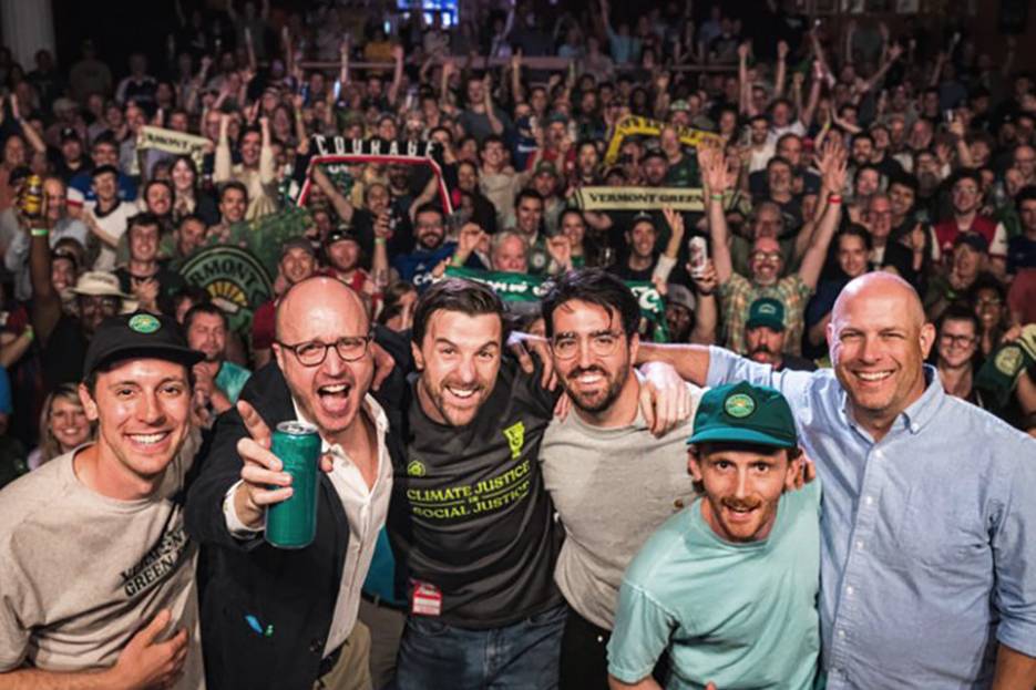 From left to right, Sam Glickman, Roger Bennett, Keil Corey, Patrick Infurna (co-founder), Matthew Wolff, and Colin Kelly (co-founder) celebrate at the “Men in Blazers” podcast featuring Vermont Green’s success story.