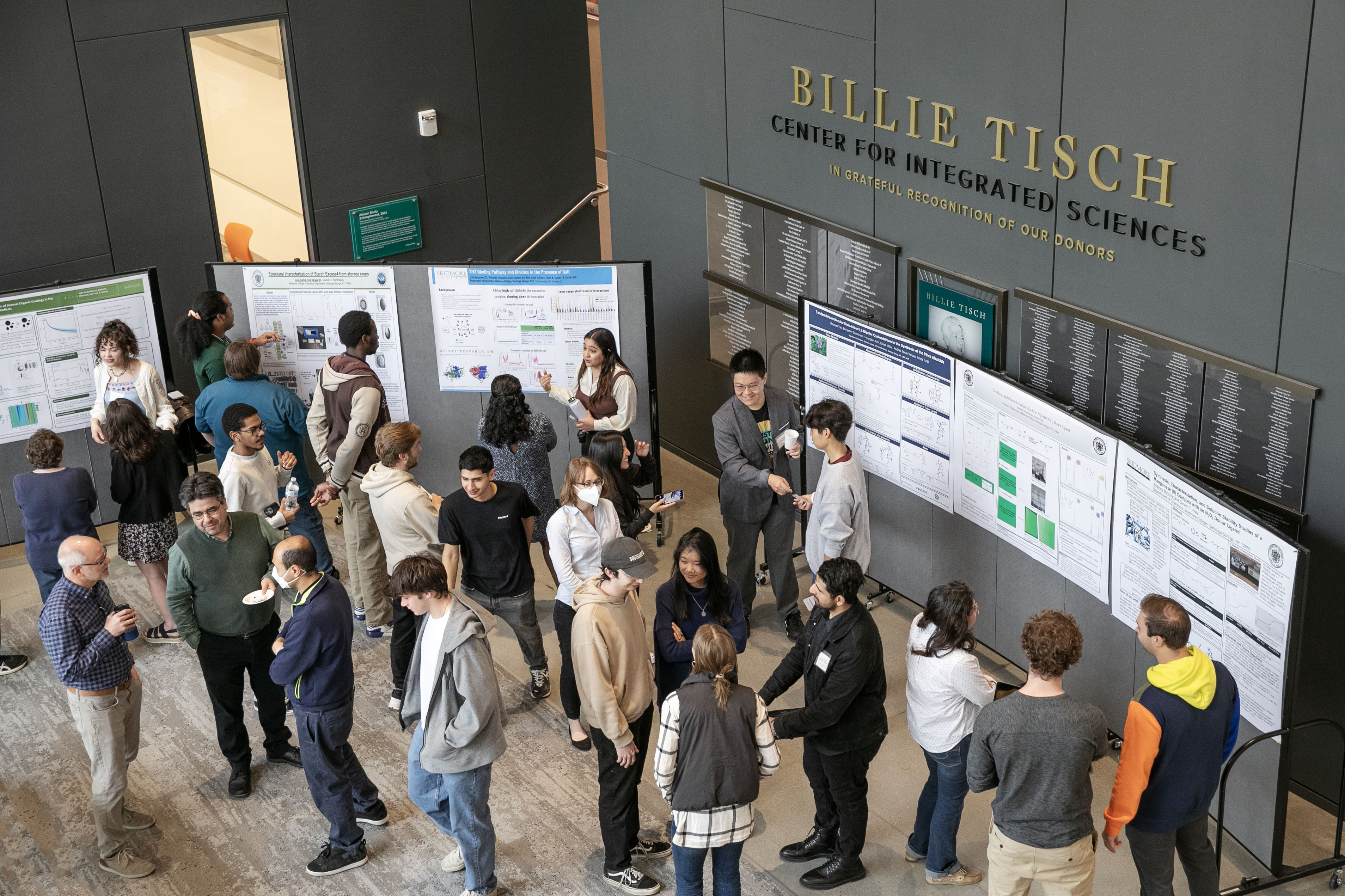 Chemistry students discuss their posters in the Billie Tisch Center for Integrated Sciences.